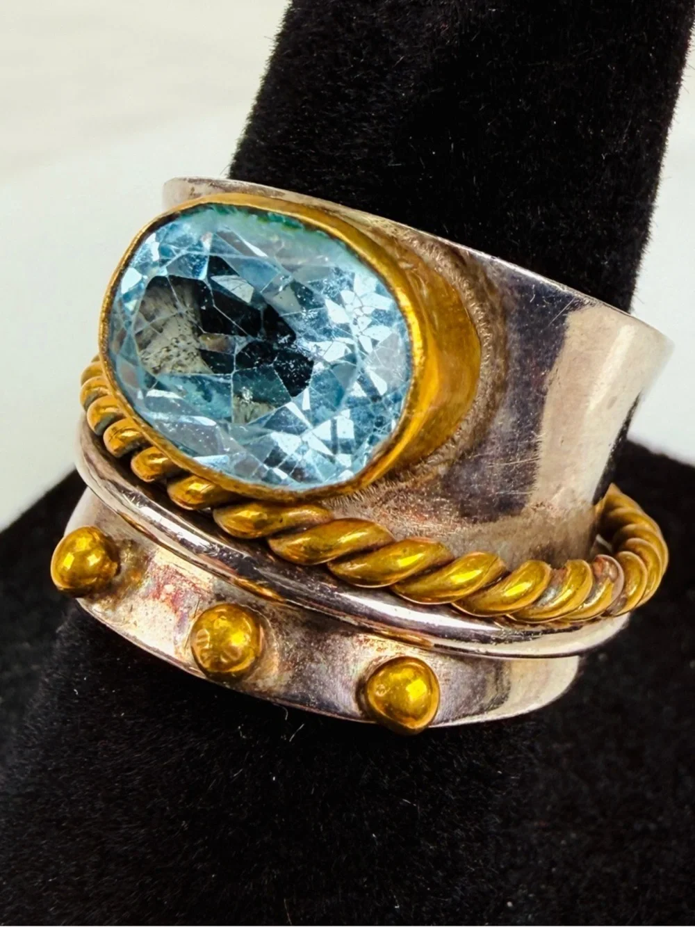 Beautiful size 5 1/2 Silvertone and bronze stamped 925 blue topaz, spinner ring